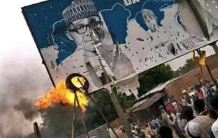 Insecurity: Frustrated protesters burn down billboards bearing Buhari, Masari images